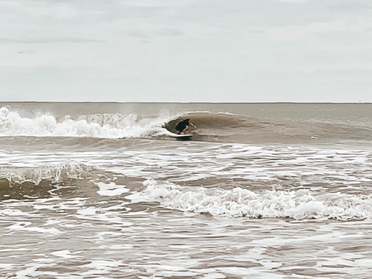 Luis surfing a barrel